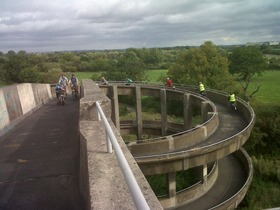 Riders cross the Curly Wurly Bridge